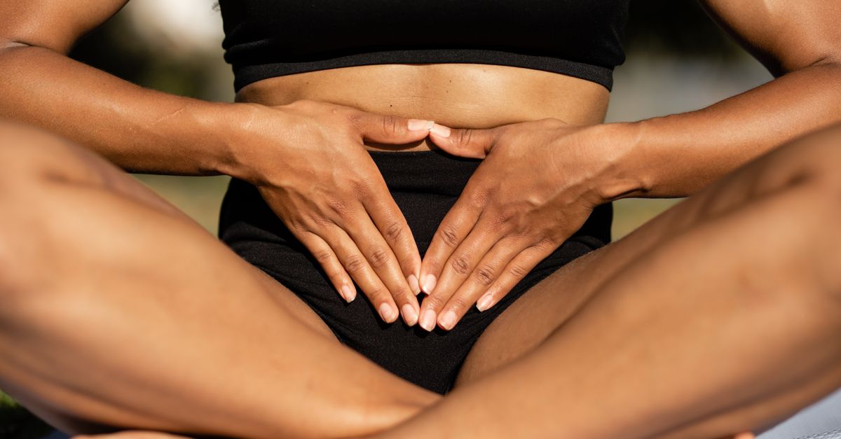 A person practicing mindfulness and balance through yoga with a focus on the core.