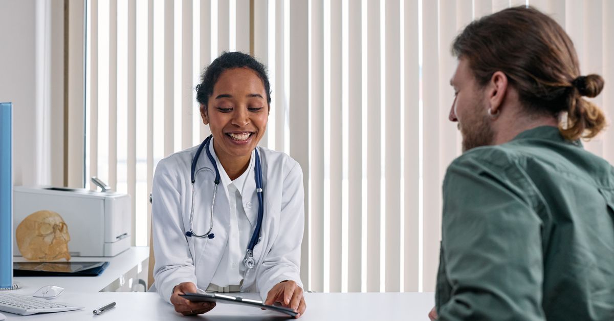 A doctor and patient engaging in a positive consultation in a bright clinic setting.